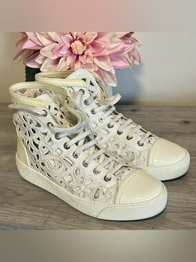 Authentic CHANEL White Camellia laser cut sneakers